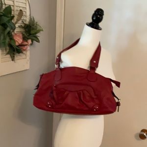 Red handbag with red funky lining